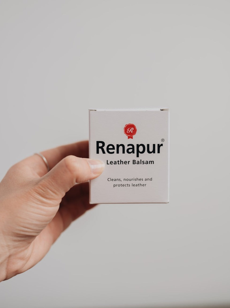 Small white box with Renapur branding for Leather conditioner balm