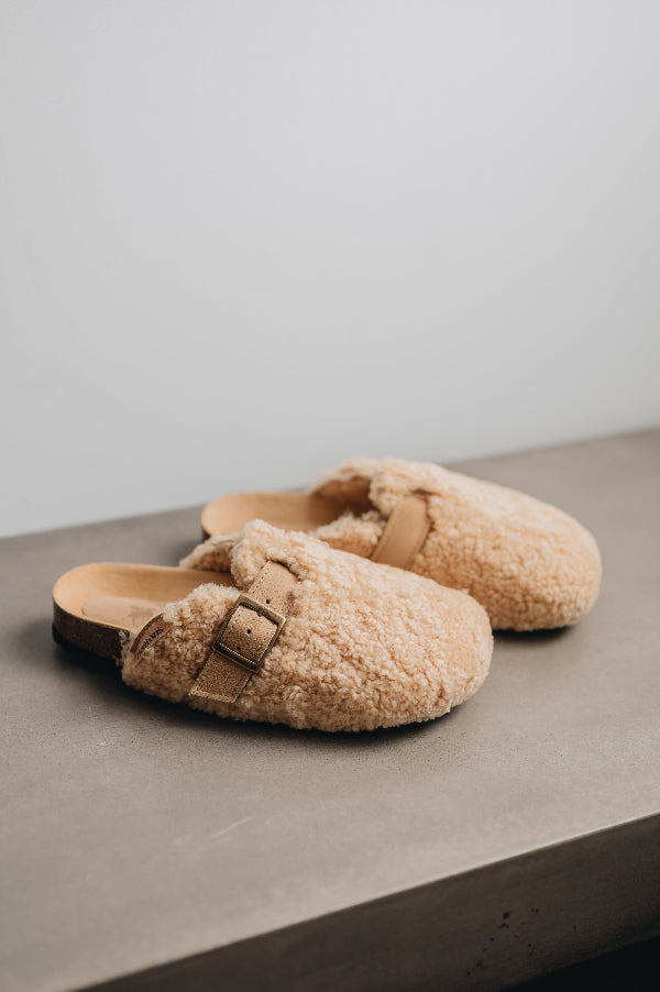 Seren vanilla outdoor slip on mule with curly vanilla sheepskin on the outside and an adjustable strap and buckle