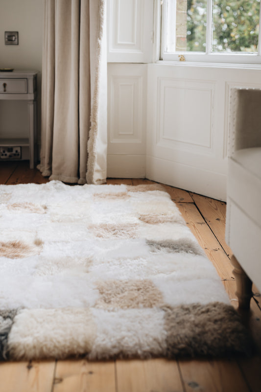 Large and Beautiful Sheepskin rug made from 20x20cm square sheepskin and sown together to create unqiue marking and patterns