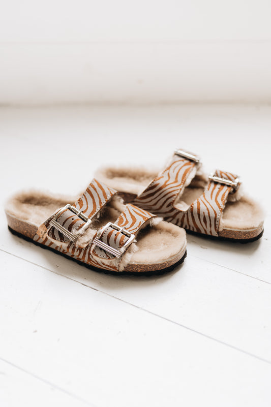 wommens sheepskin sandal with 2 buckle traps and a reflective zebra pattern finish
