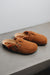 High angle of the baba rust clogs with dyed sheep skin and adjustable straps