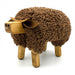 side view of wood and cotton bull shaped footstool 