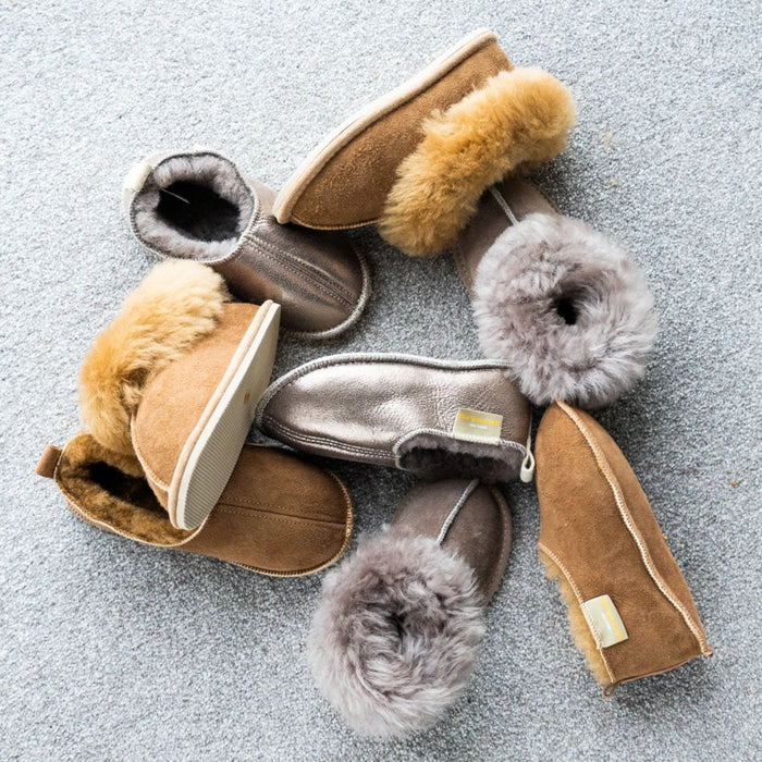 Margot children's Sheepskin Petwer grey soft soled slippers amongst a variety of other kid's slippers.