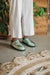 Stylish women’s ankle sheepskin slippers with durable hard soles for versatile use
