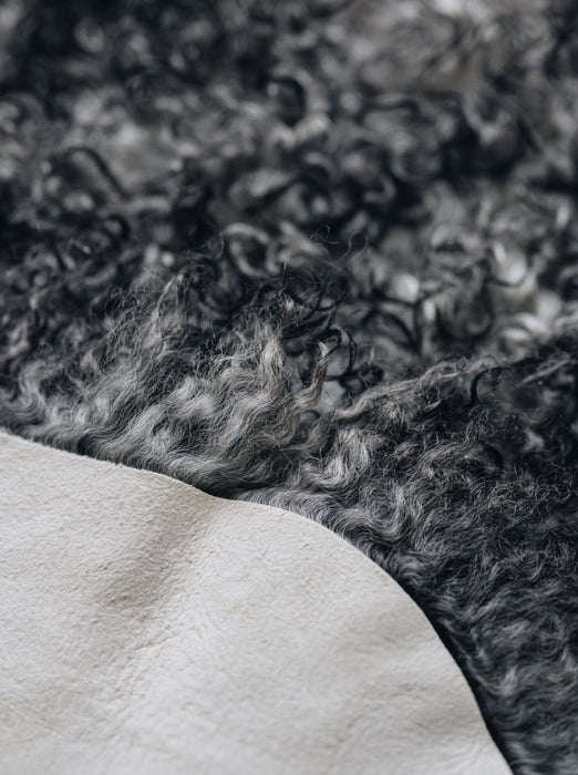 Detail of a Gotland curly natural grey rug 