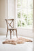 Natural melange  coloured Swedish Sheepskin Rug draped over a wooden chair sitting in a window