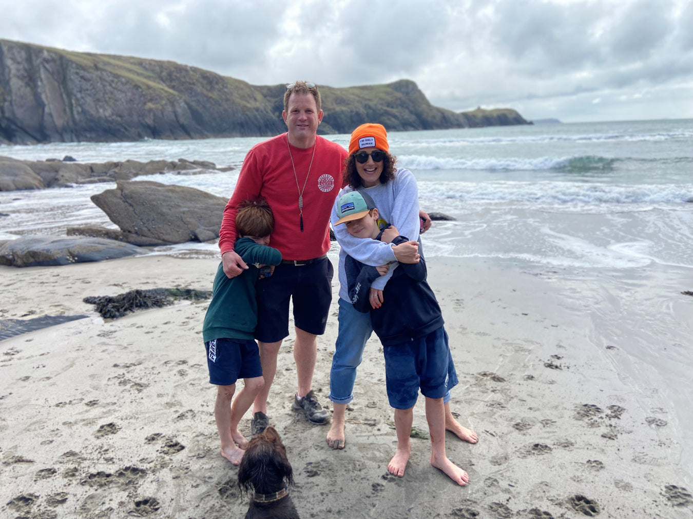 The Heaton Family owners of Westmorland Sheepskins Online stood on a beach