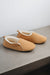 Side view of Grace - a light soft-soled sheepskin slipper, that is handcrafted in Europe from the highest grade of premium Spanish merino sheepskin.