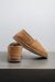 Side and rear view of clean loafer style sheepskin slipper, hand crafted from Spanish merino sheepskin.