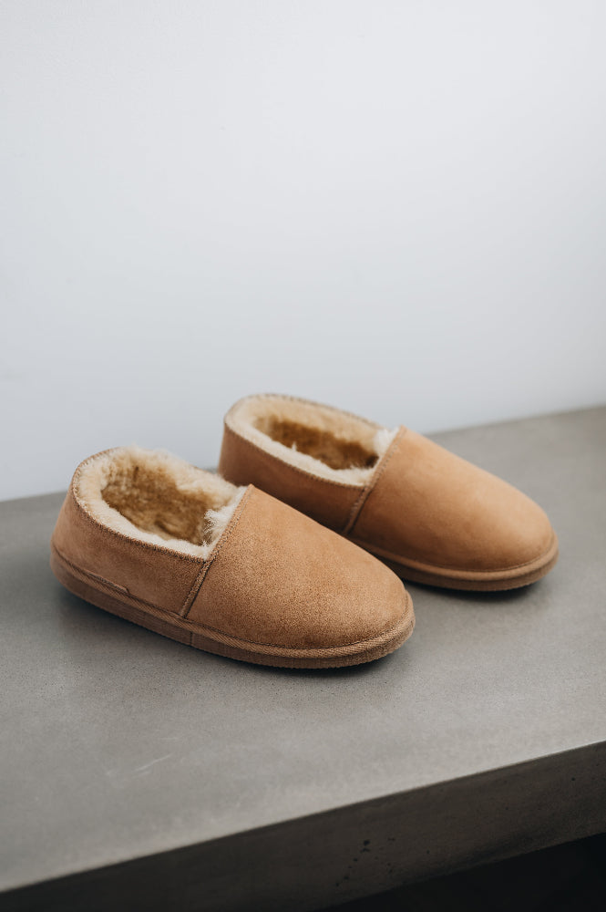 Top and side view of clean loafer style sheepskin slipper, hand crafted from Spanish merino sheepskin.