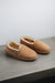 Top and side view of clean loafer style sheepskin slipper, hand crafted from Spanish merino sheepskin.