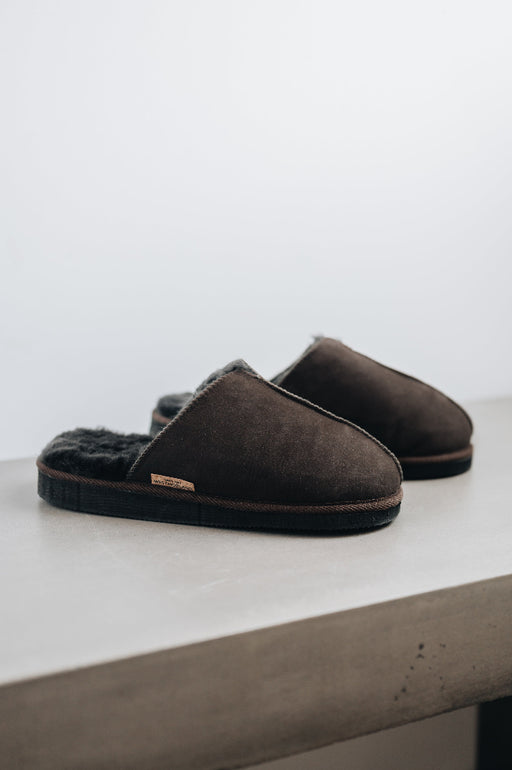 Side view of the brown men's sheepskin mule slipper called Walter.