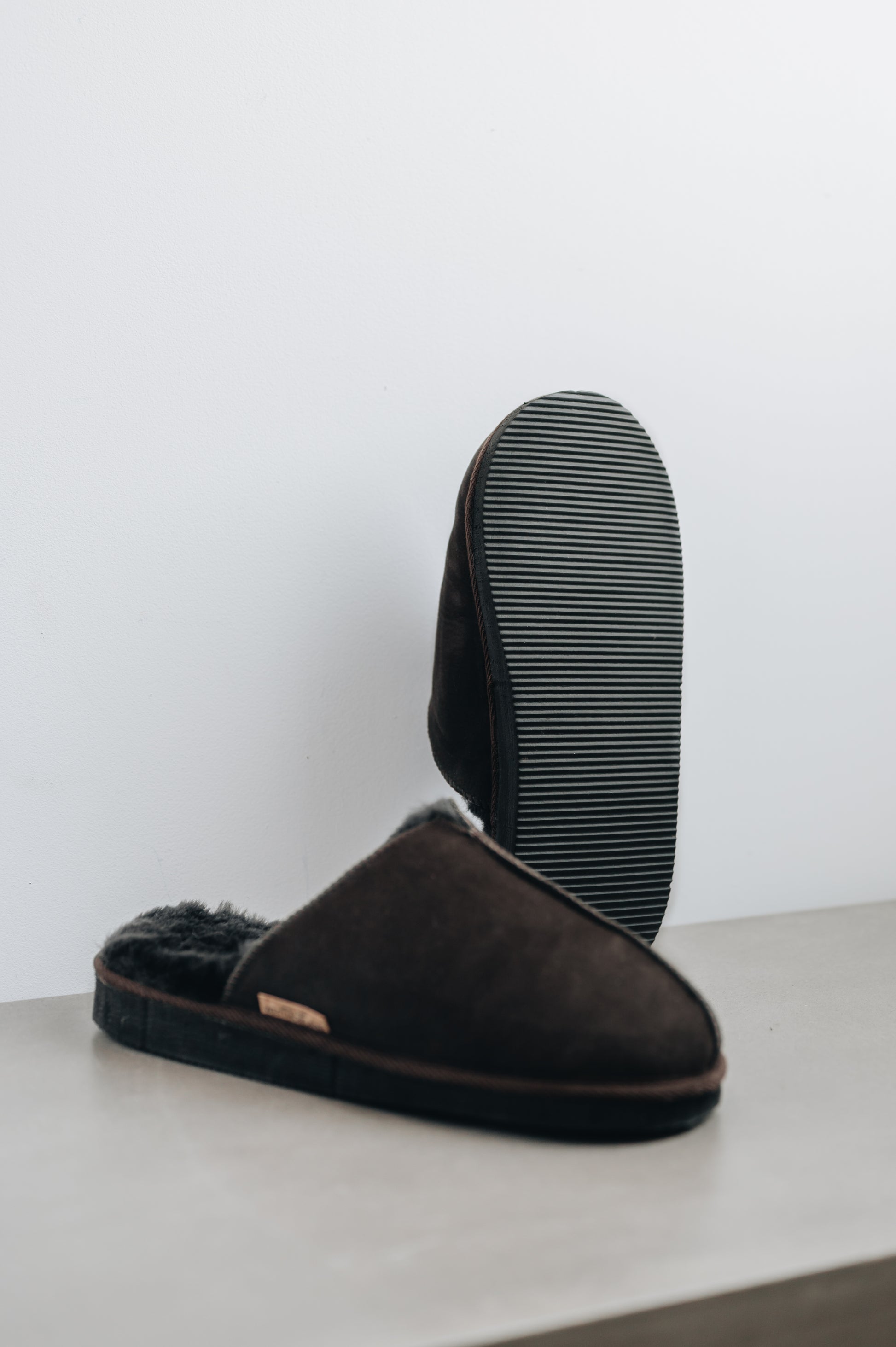 Bottom view showing the sole of the brown men's sheepskin mule slipper called Walter.