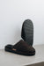 Bottom view showing the sole of the brown men's sheepskin mule slipper called Walter.