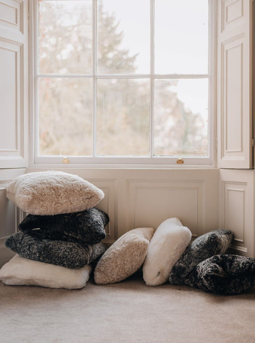 Waste less sheepskin cushion covers in cotton, black smoke, oatmeal and marengo grey