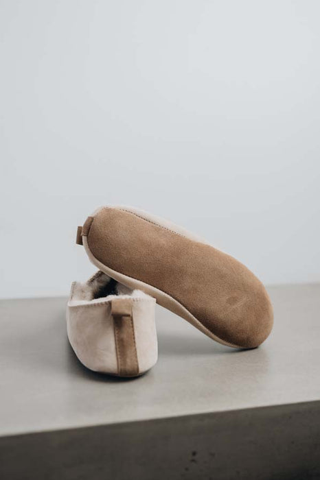 Bottom view of Grace, a light soft-soled sheepskin slipper, showing the soft suede sole of the bottom of the slipper.