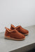 Rust coloured ankle-high men’s sheepskin slipper - Henry profile view