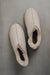 Birds eye view of Henry ankle-high sheepskin slipper showing plush natural sheepskin wool inside