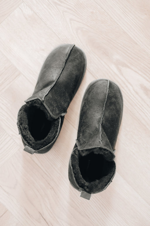 mens sheepskin slippers in a dark grey colour, shown from above
