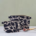 Large and Small Navy Blue Abstract Small Creatures Patterned Blästa Henriët Linen Wash Bag. Includes gold zipper for easy opening.