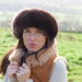 Brown Sheepskin Hat on the head of A model