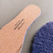 Lilac AW22 colour Sheepskin Children's Cuttable Insoles. Cut to size. Close Up of Cork Cuttable back with Westmorland Sheepskins Logo.