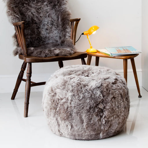 Taupe rounded Sheepskin Ottoman / Footrest.