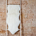 Double Short Wool Icelandic Sheepskin Rug in white, hung over white ladder.