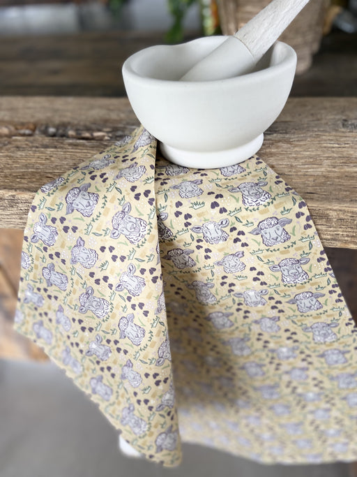 Polka Face Tea Towel draped over countertop with Mortar and Pestle.