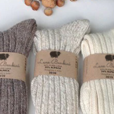 Thick, cosy socks made from 65% wool and 35% alpaca, featuring a long length ideal for wellies and boots, with no synthetic materials