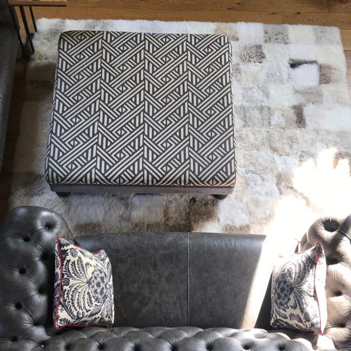 Patchwork Sheepskin Rug underneith coffee table and sofa.
