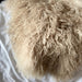 textured picture of Mongolian sheepskin rug