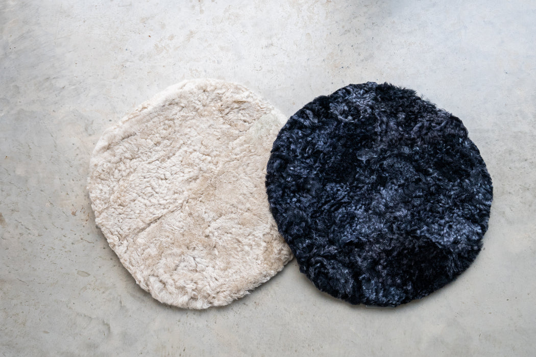 Oatmeal and Black Smoke Round Waste Less Sheepskin Padded Seat Pad.