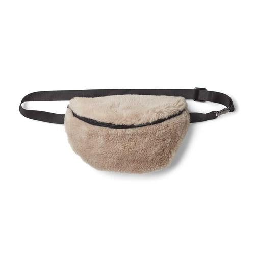 Saki Sheepskin Bumbag in Beige. Features black strap and black zippable front.