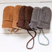 A row of baby / toddler Sheepskin Mittens in Tan, Brown and Grey. Features a string cord to stop losing them.