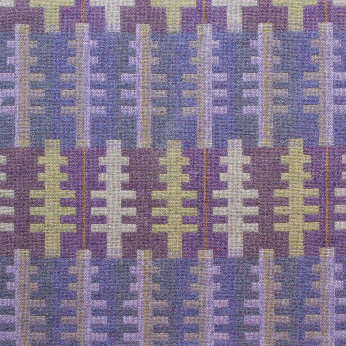 Close up of Forest design, featuring tree like shapes in purples, greens and creams. Repeating tree pattern on lilac and indigo stripes.