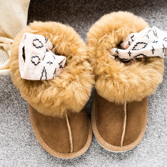 Orla Chestnut Children's Sheepskin Hard Soled Slippers. A Sheepskin Slipper with a cuff of Warm cream colour Sheepskin around the ankle, with a hard wearing outer sole.