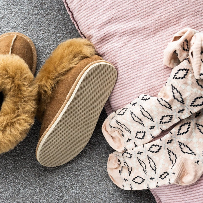Orla Chestnut Children's Sheepskin Hard Soled Slippers. A Sheepskin Slipper with a cuff of Warm cream colour Sheepskin around the ankle, with a hard wearing outer sole.