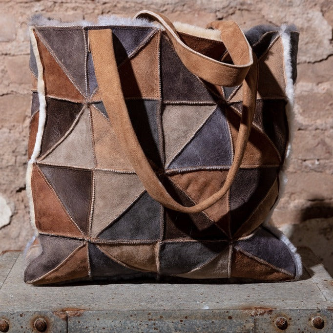 Milano Sheepskin Shopper bag. A sheepskin shopper, made from triangles of different colour sheepskin, sewn together into geometric pattern. Square shaped Shopper with shoulder straps.