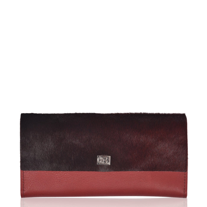 Small Vermont Oxblood Colour Leather and Cowhide purse. Made by Owen Barry.
