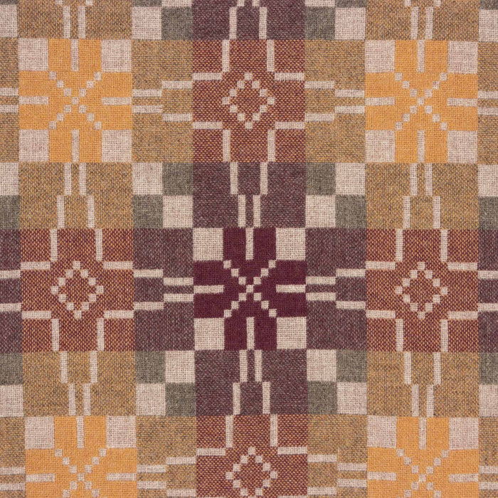 Reverse Fabric for Melin Tregwynt Vintage Star Woven Wool Cushion in Clay. A mixture of naturally warm colours including oatmeal, terracotta, yellow and maroon cushion with vintage star repeating pattern.