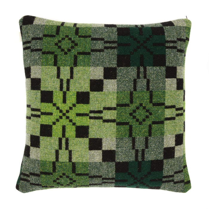 Reverse of Melin Tregwynt Vintage Star Woven Wool Cushion in Woodland. A green and deep brown/black cushion with vintage star repeating pattern.